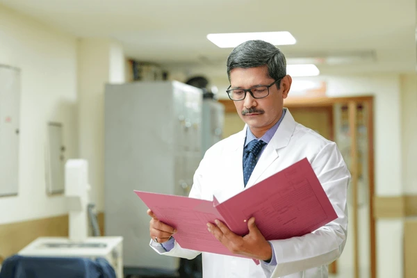 indian-senior-doctor-watching-medical-600nw-2274219845